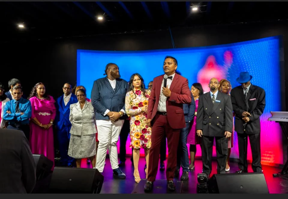 Pastor Mike Basdeo and members of the Christ Tabernacle Church community gathered on stage.